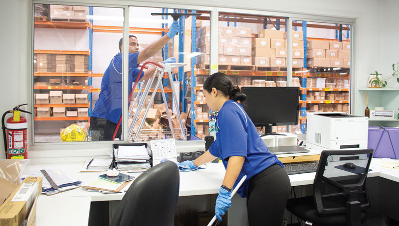 A team of cleaners cleaning an office | Featured image for the commercial cleaning in Brisbane page.